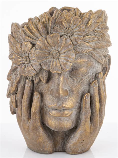 Kvetináč v tvare hlavy s kvetmi